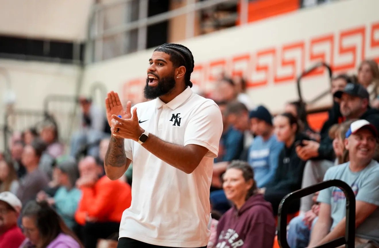Coach Zay Gentry firing up his team from the sideline